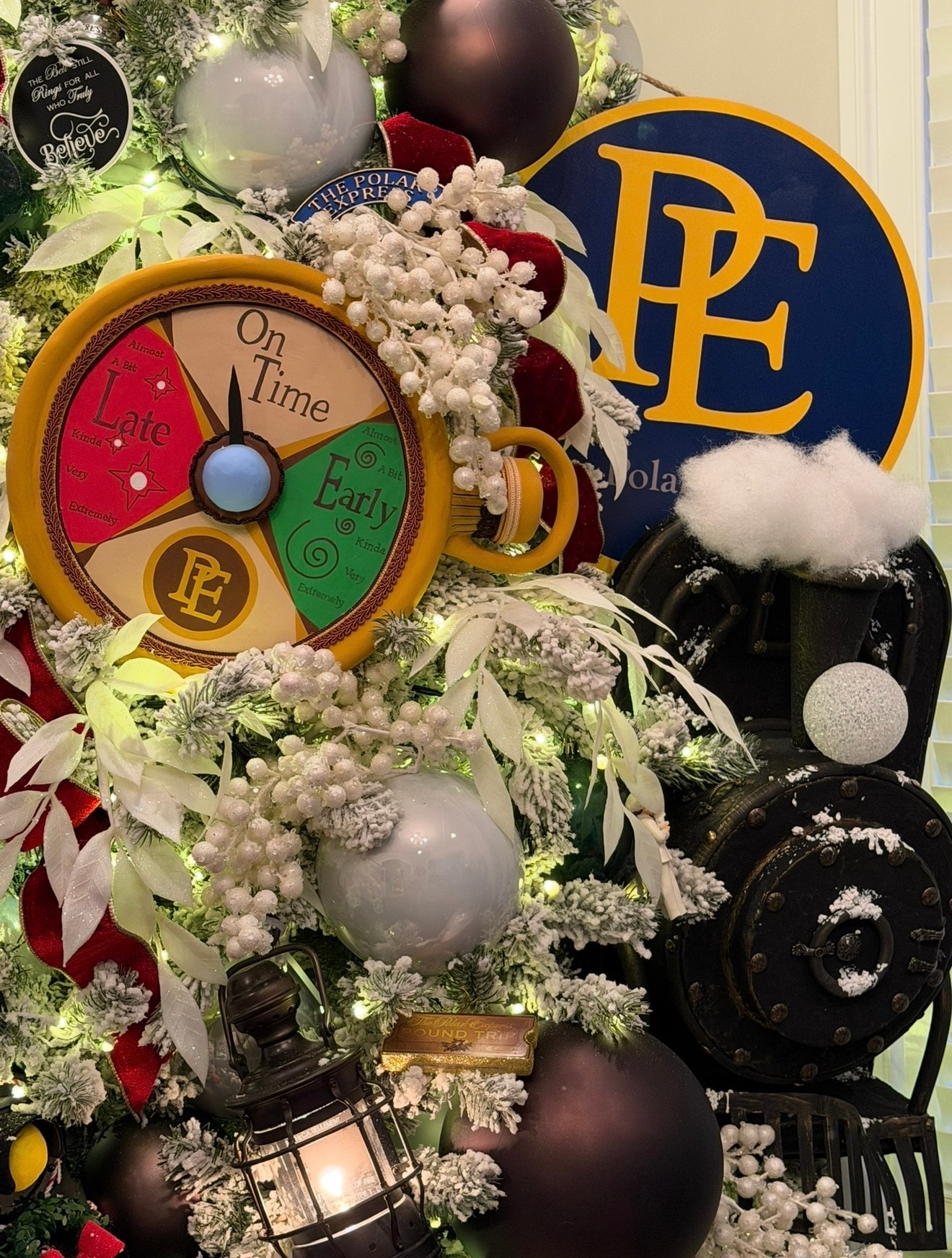 Polar Express themed Christmas tree — full view with PE ornaments and lanterns