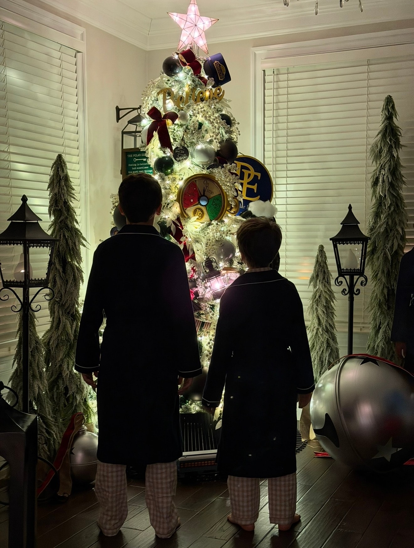 Polar Express themed Christmas tree — aurora borealis night scene